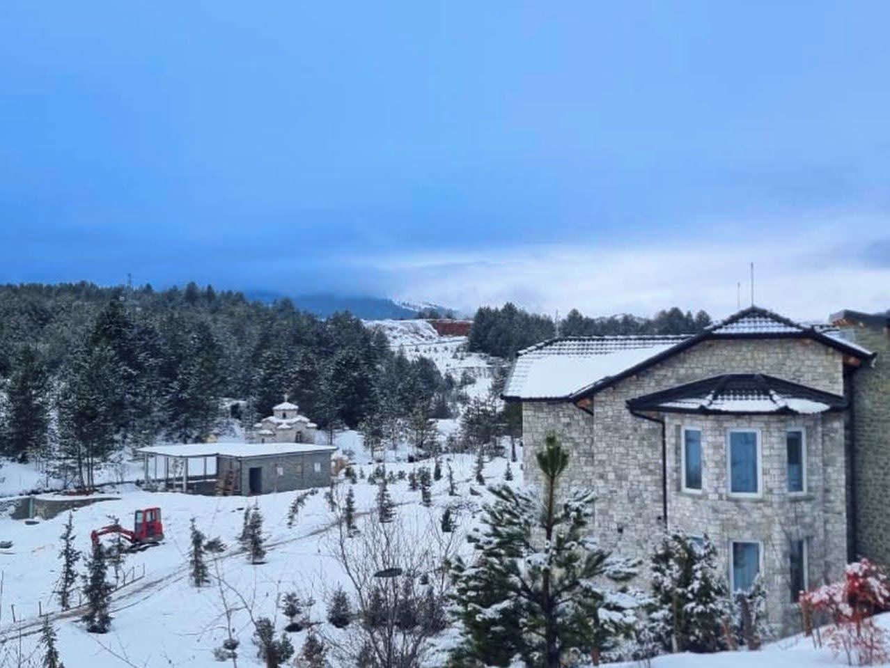Lush organic farm and surrounding green grounds of the Ura e Kovaçit estate