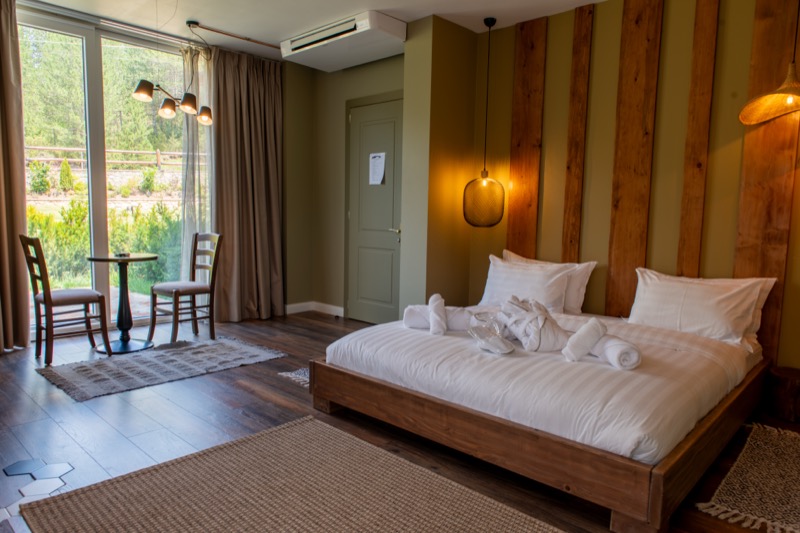Standard Room cozy bedroom interior with choice of twin or double beds and elegant minimalist design