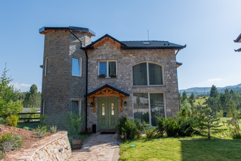 Private wood and stone villas with scenic garden and mountain views at Ura e Kovaçit